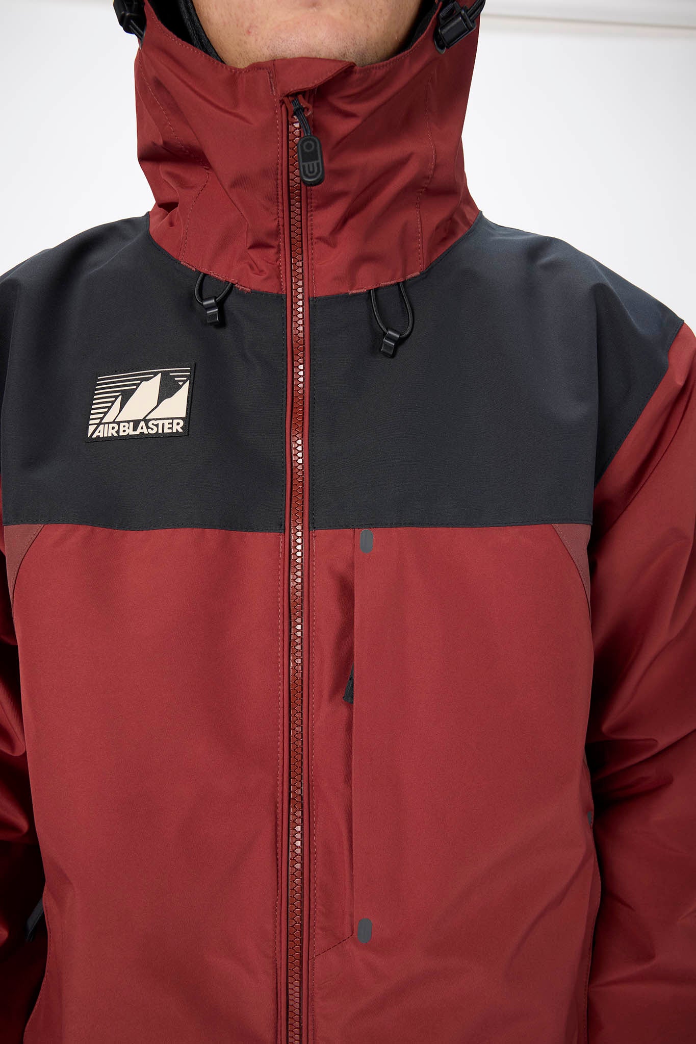Red and black jacket with a brand logo on a white background