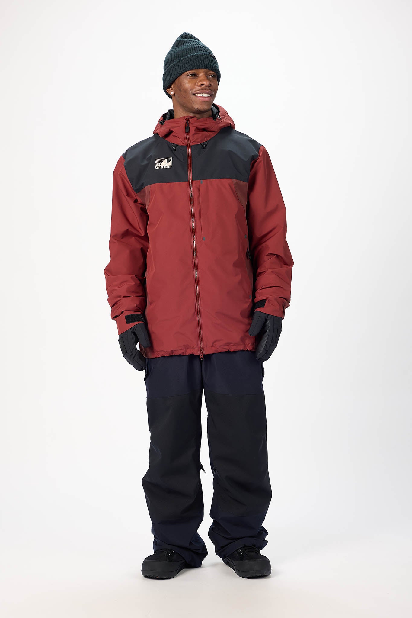 Person wearing a red and black jacket with a logo on a white background