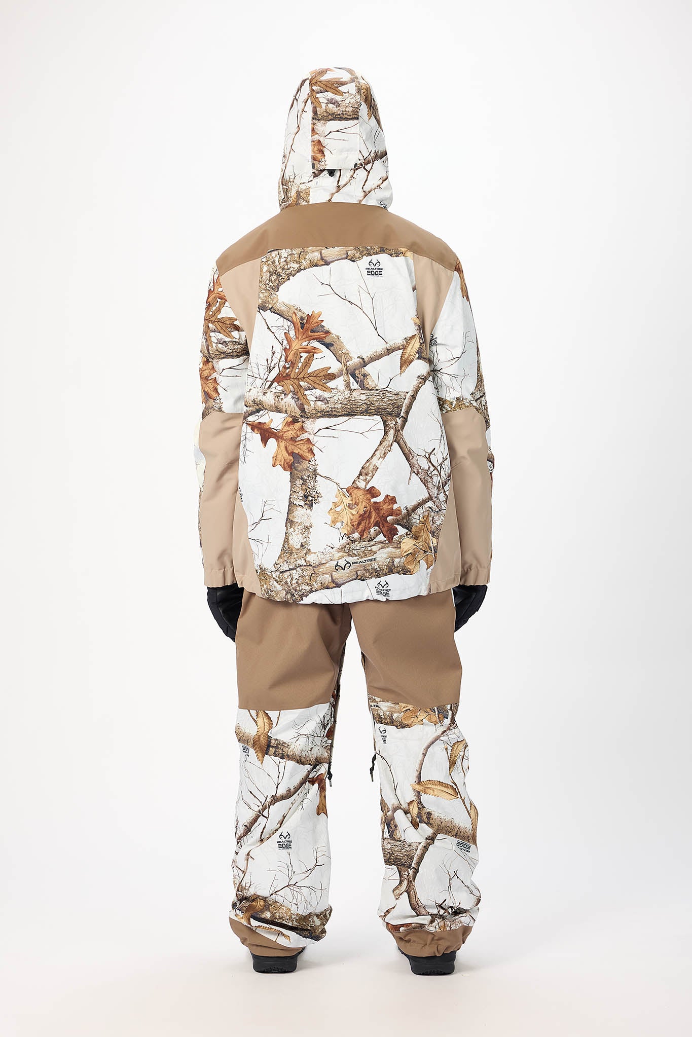 Camouflage snowsuit with a hood on a white background