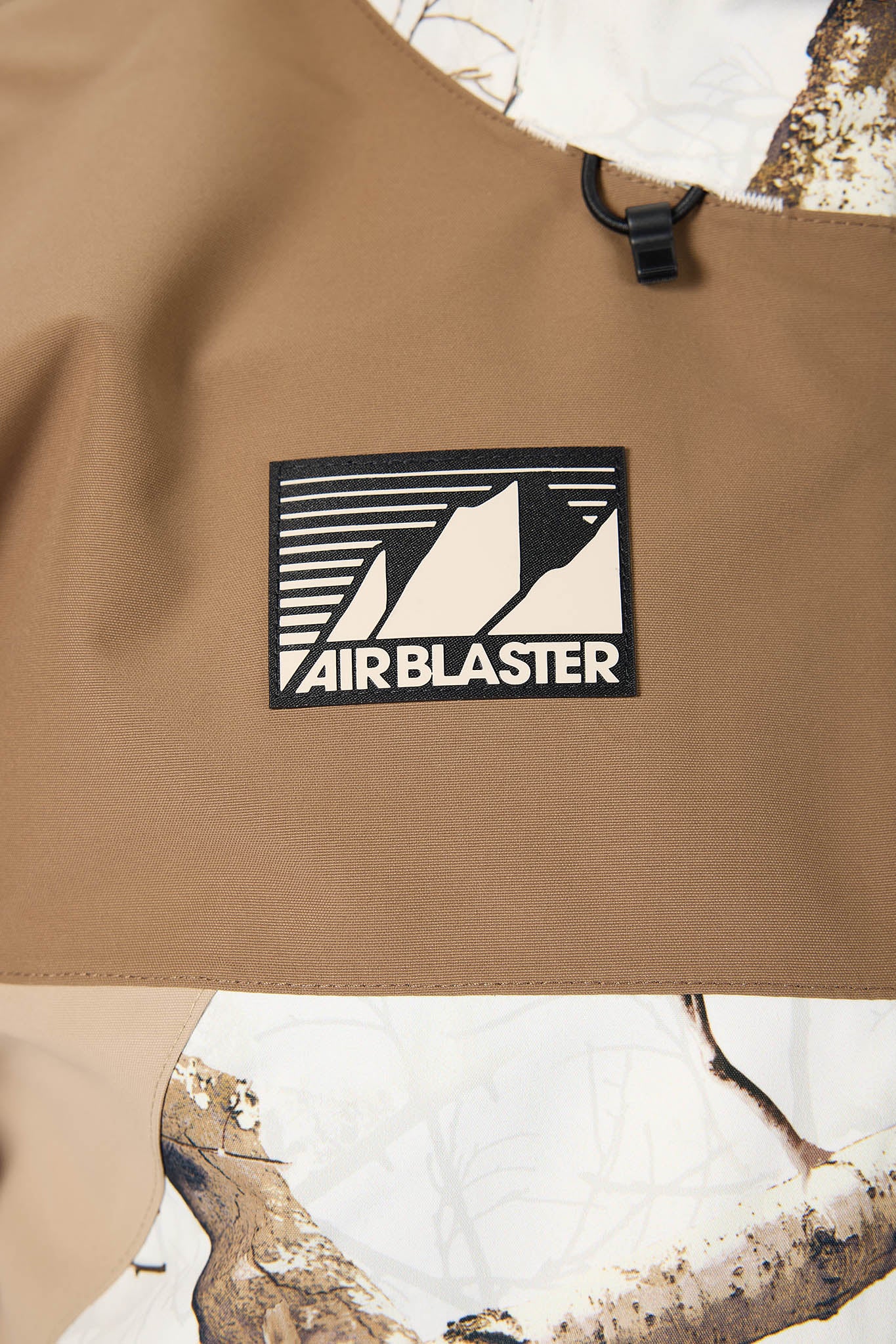 Brown bag with Air Blaster logo against a natural background