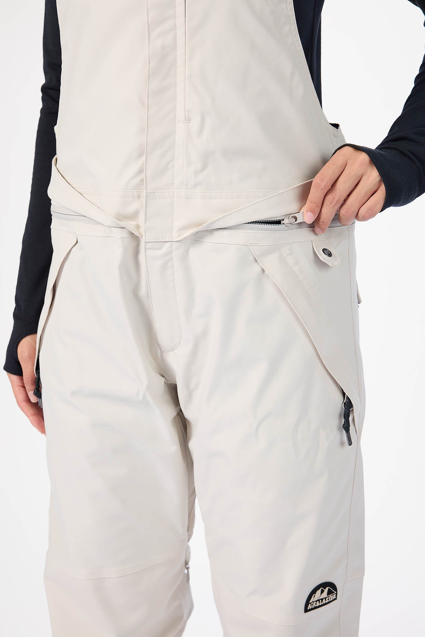 Beige pants with a brand logo on a white background