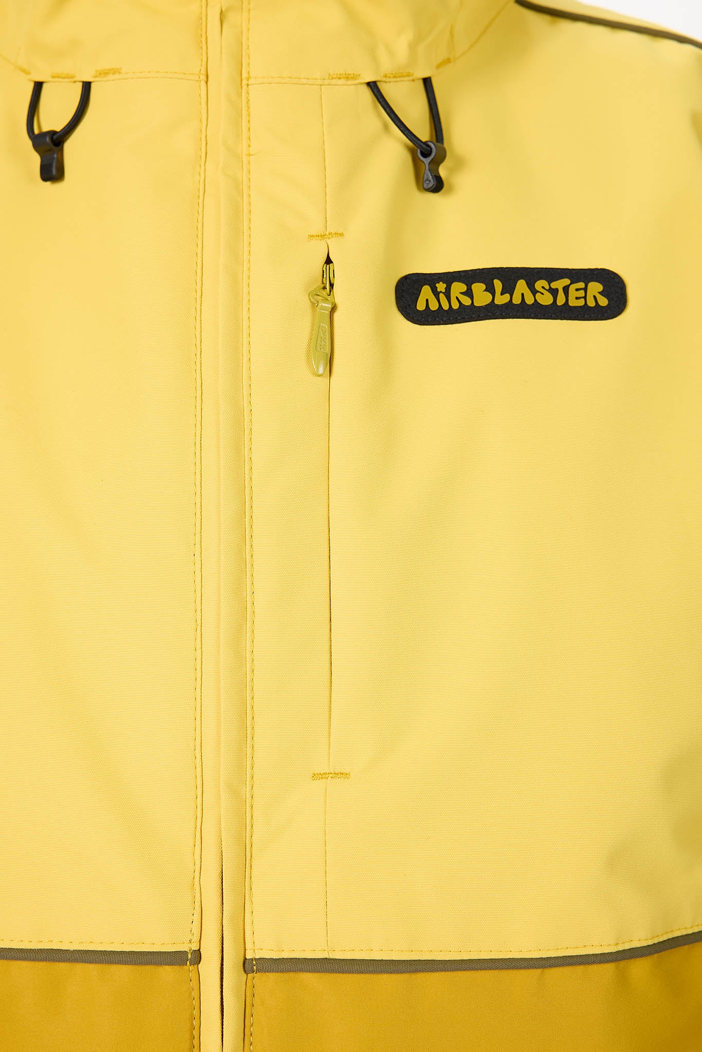 Yellow jacket with 'Airblaster' logo on a close-up of the chest area.