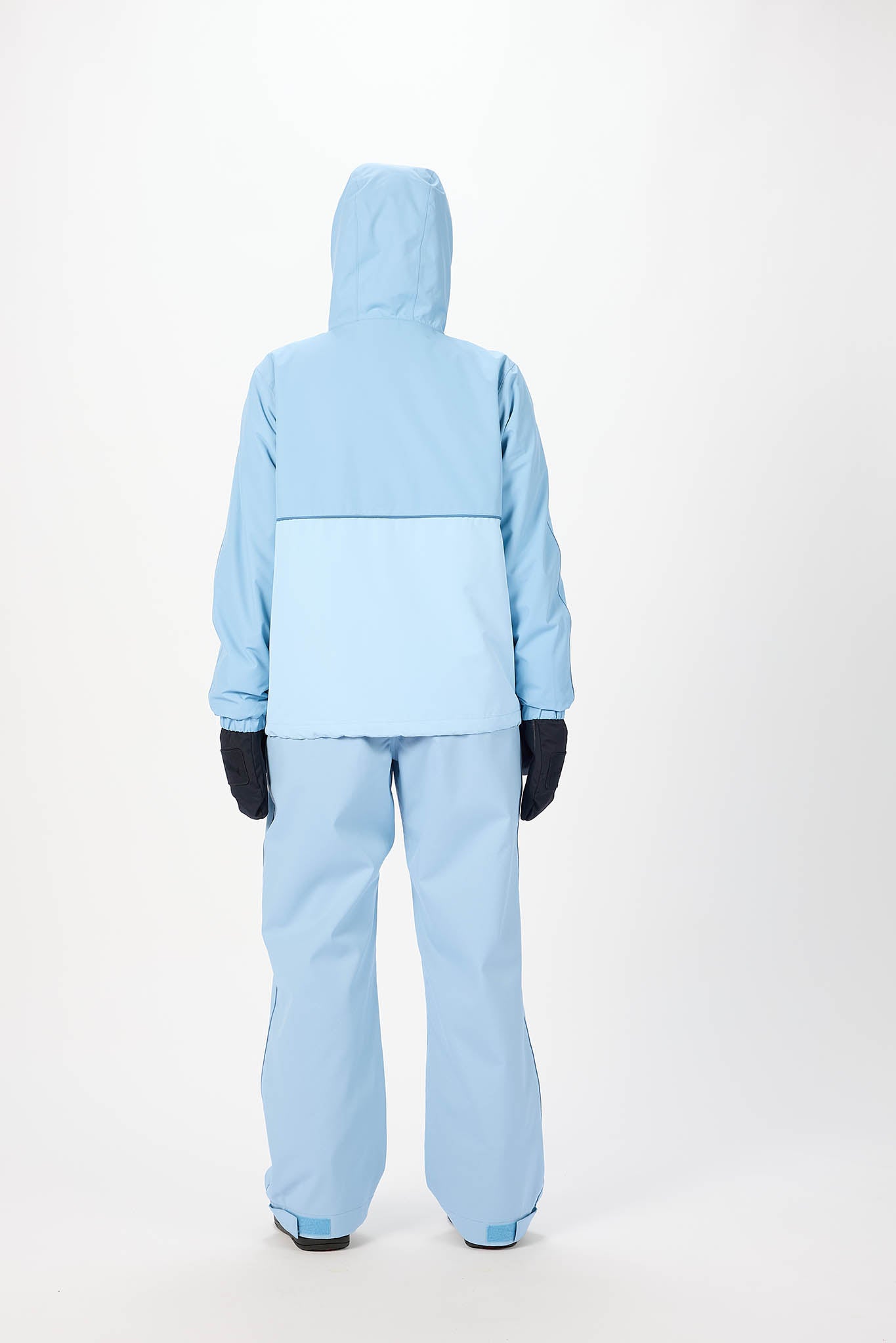 Light blue snowsuit worn by a person on a white background