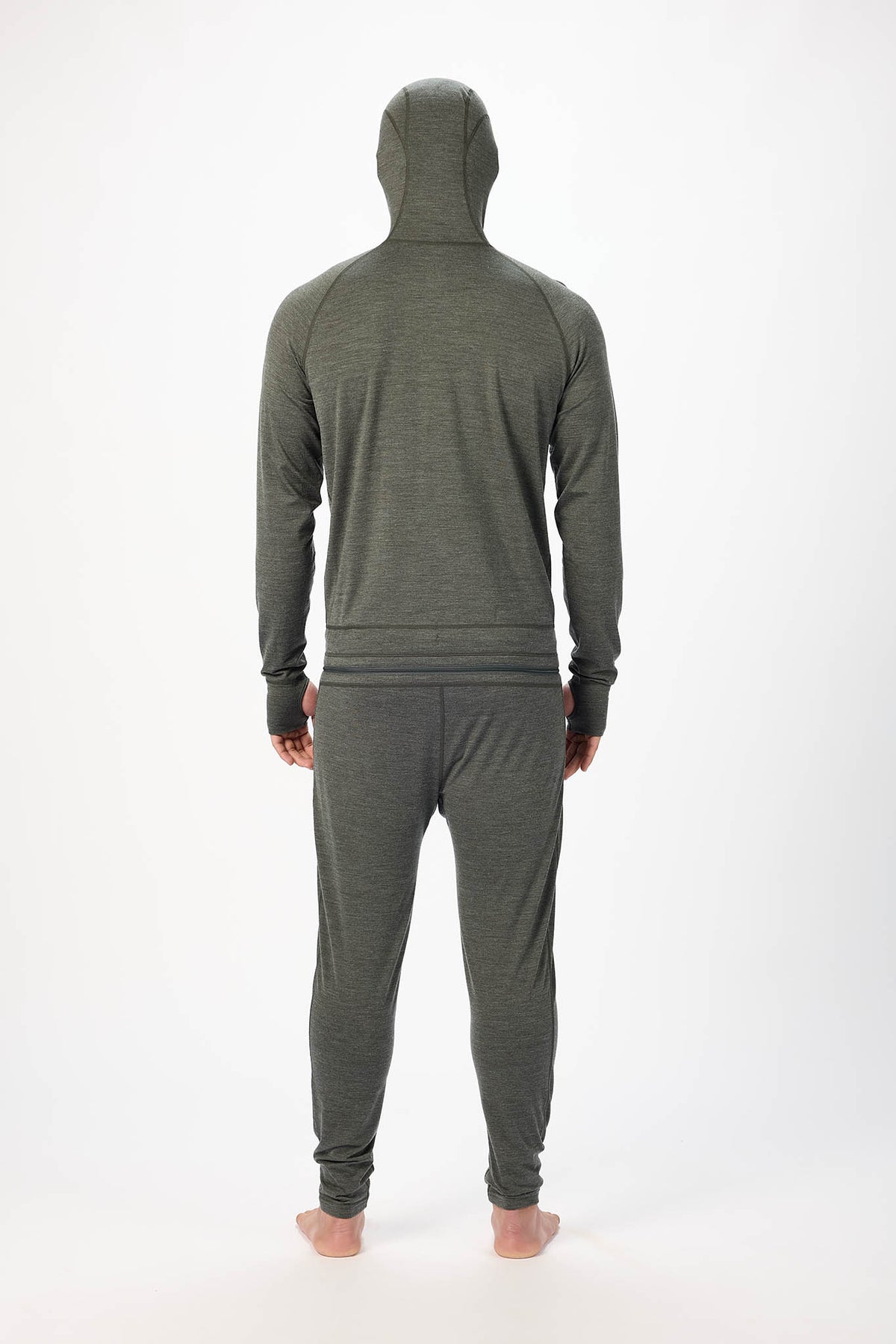 A man viewed from the back wearing a dark olive green hooded sweatshirt and matching jogger pants against a plain white studio background.