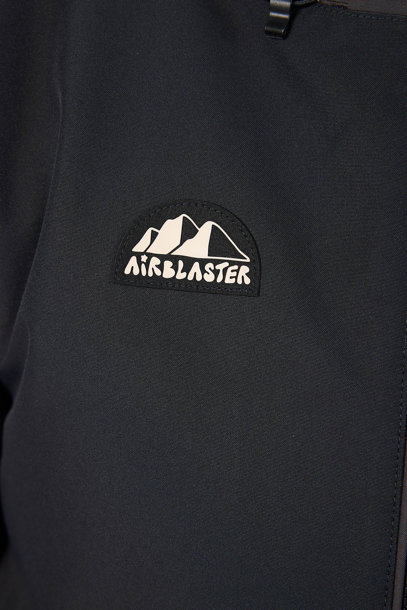 Black apron with a logo on the chest