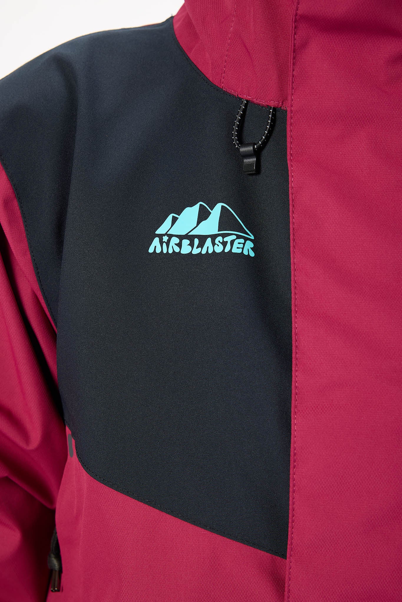 Close-up of a jacket with Airblaster logo on a white background