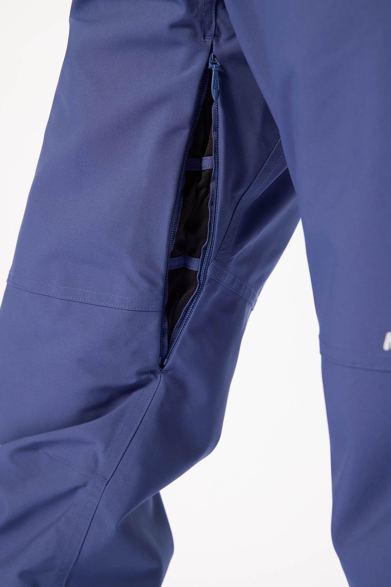 Close-up of blue pants with a white background