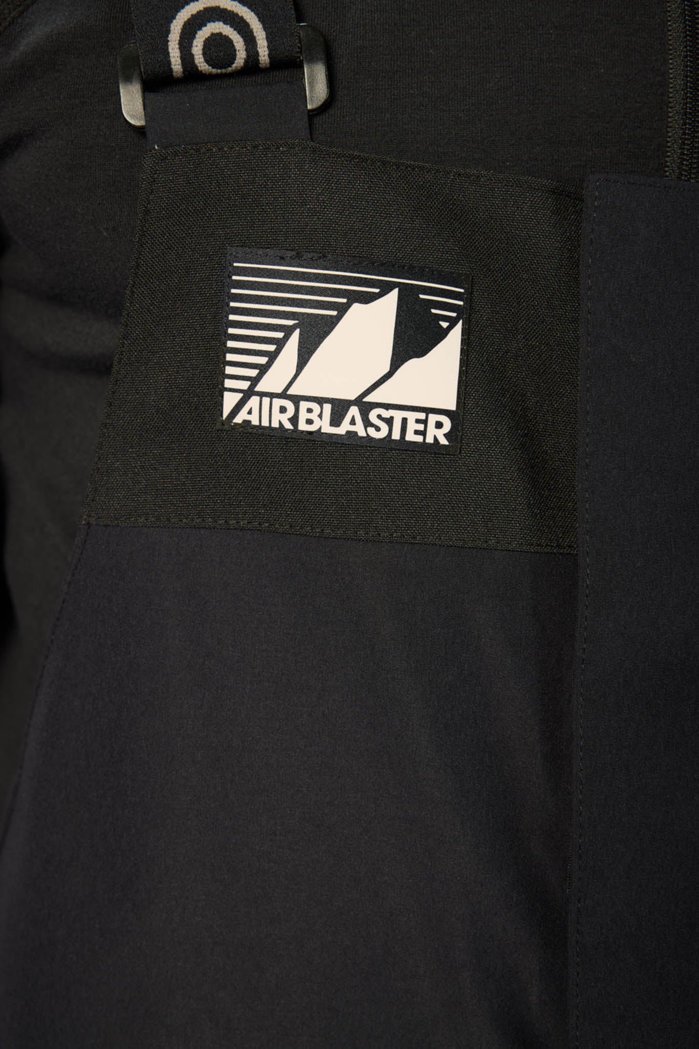 Black jacket with Airblaster logo on a pocket