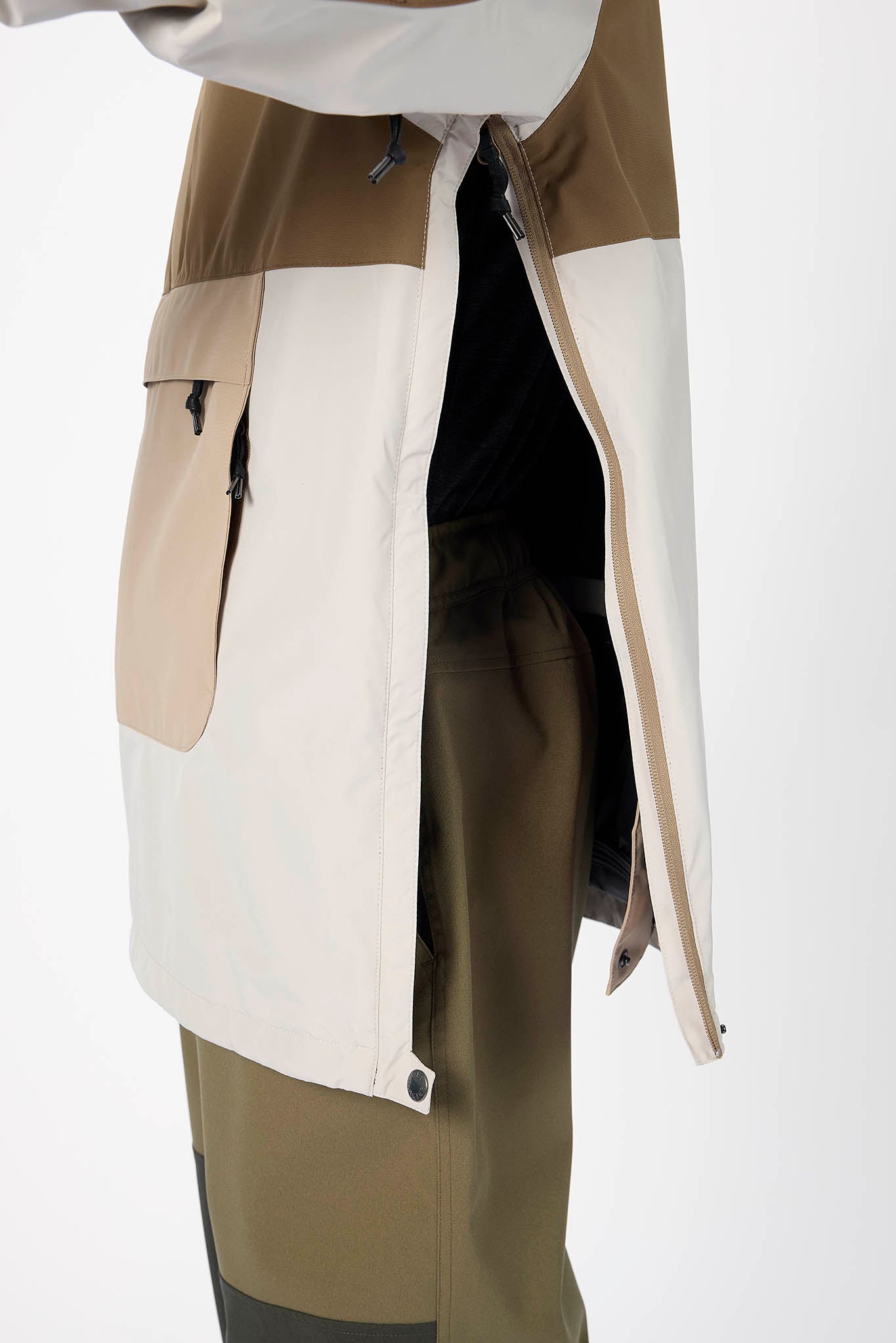Two-tone jacket with beige and white panels on a white background