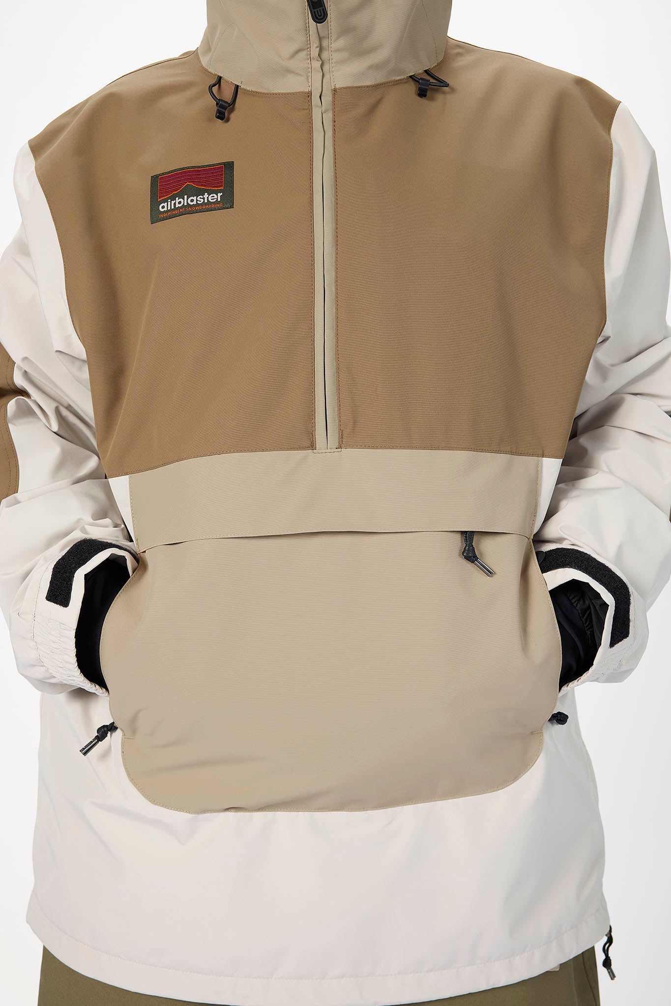 Two-tone jacket with beige and white sections, featuring a visible brand logo on the chest.