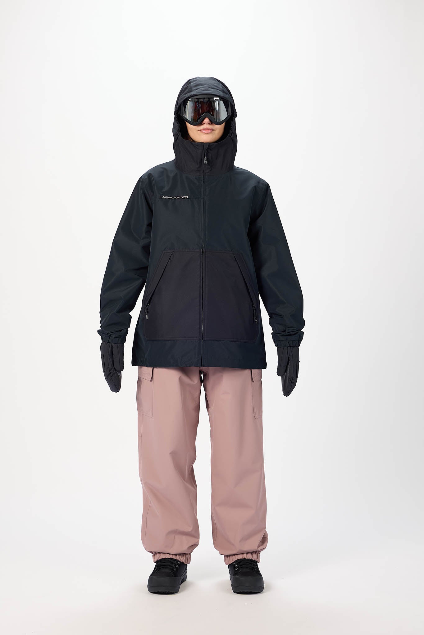 Person wearing a black jacket and pink pants on a white background