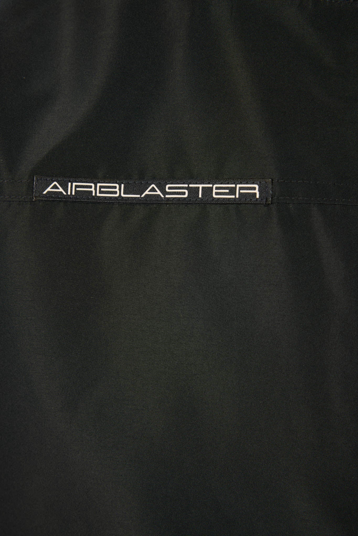 Black jacket with 'AIRBLASTER' logo on a dark background