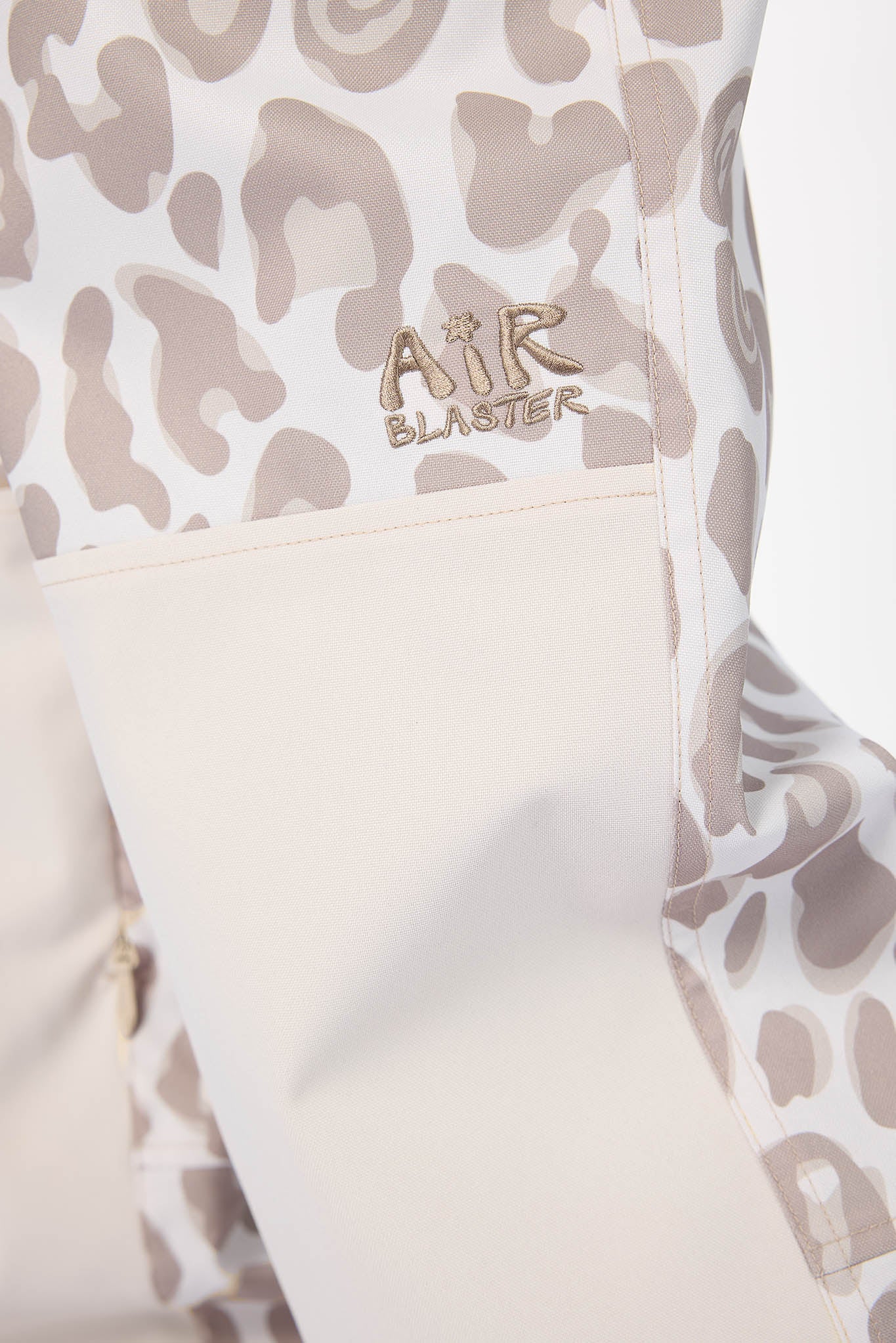 Leopard print jacket with 'Air Blaster' logo on a light background
