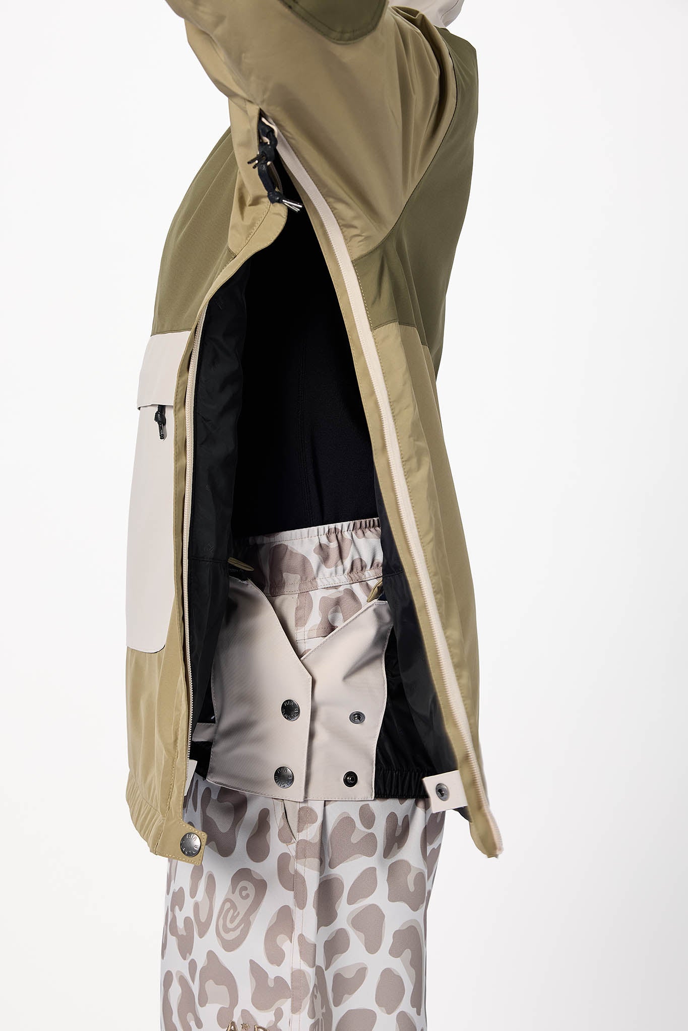 Person wearing a beige jacket with a white background