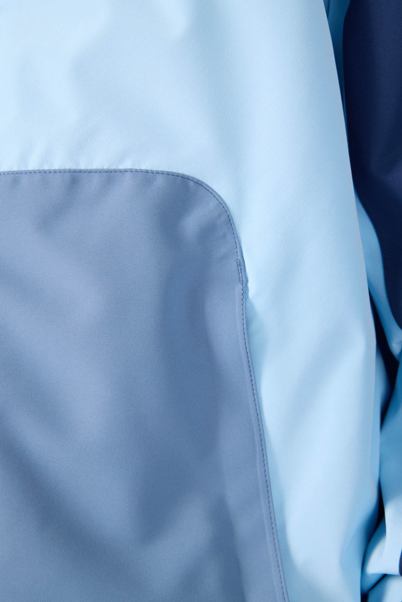 Close-up of light blue fabric with a subtle texture