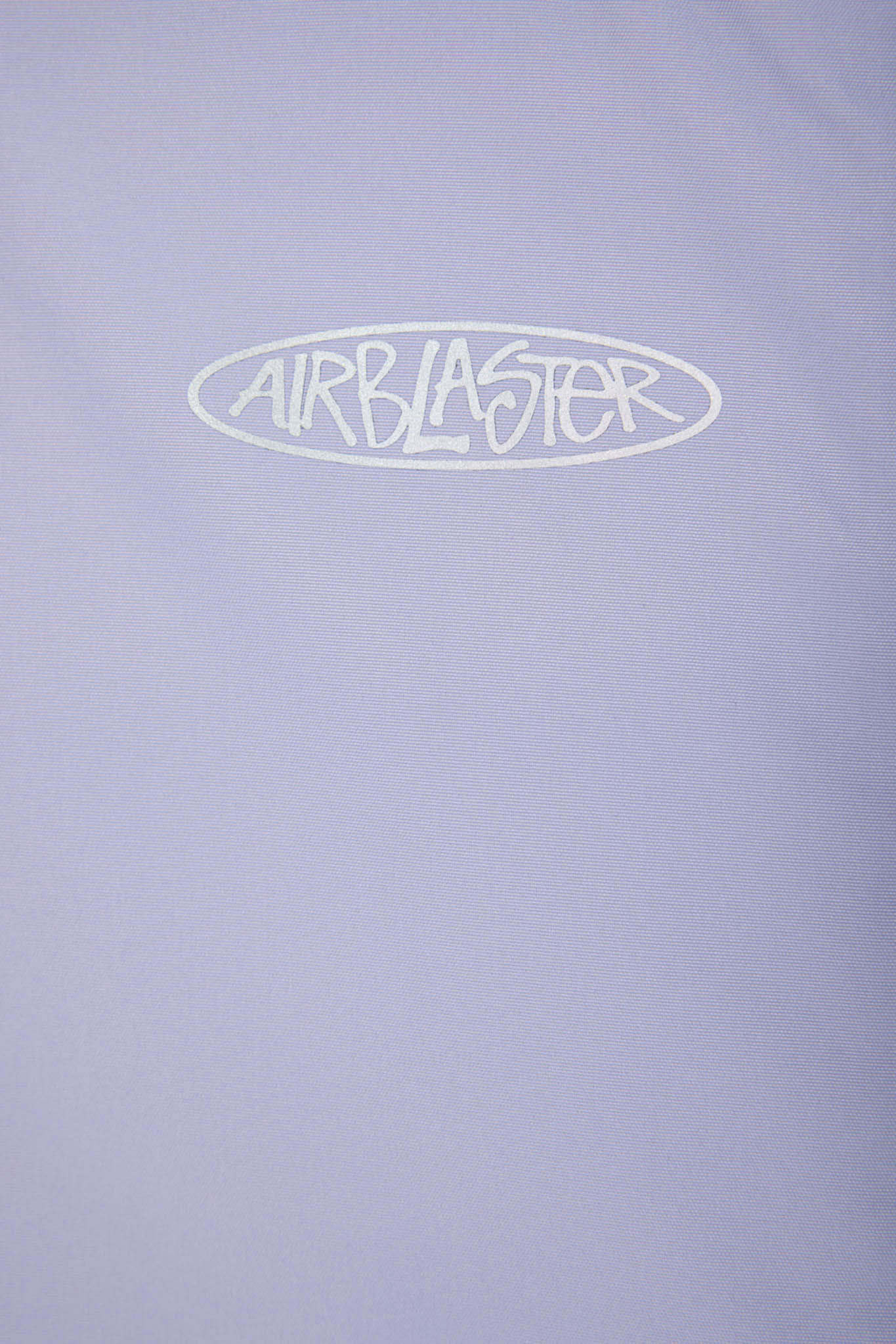 A close-up of a light lavender-purple fabric surface with a white outlined oval logo reading 'AIRBLASTER' across the upper center.
